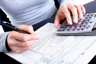 woman using calculator